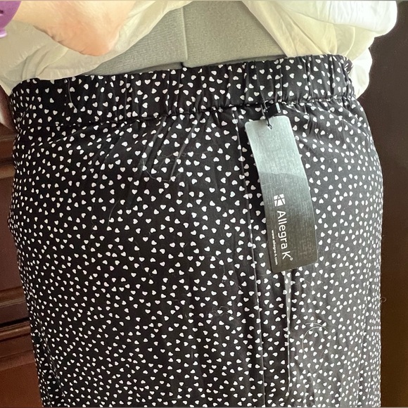 Allegra black w/ tiny hearts covering skirt w/ 4-5” ruffle flouncing hem. - Picture 5 of 12